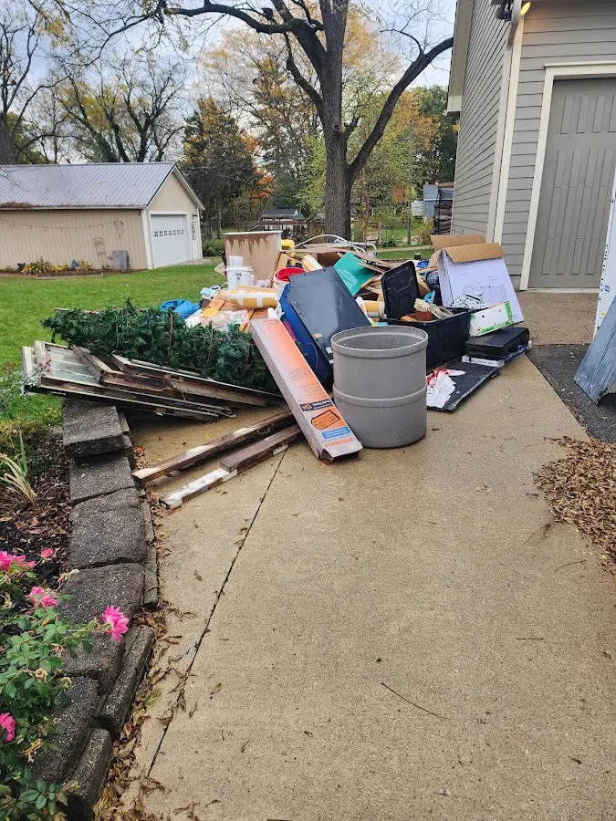 Dumpster being loaded with debris for Commercial Dumpster Rental in McAlester